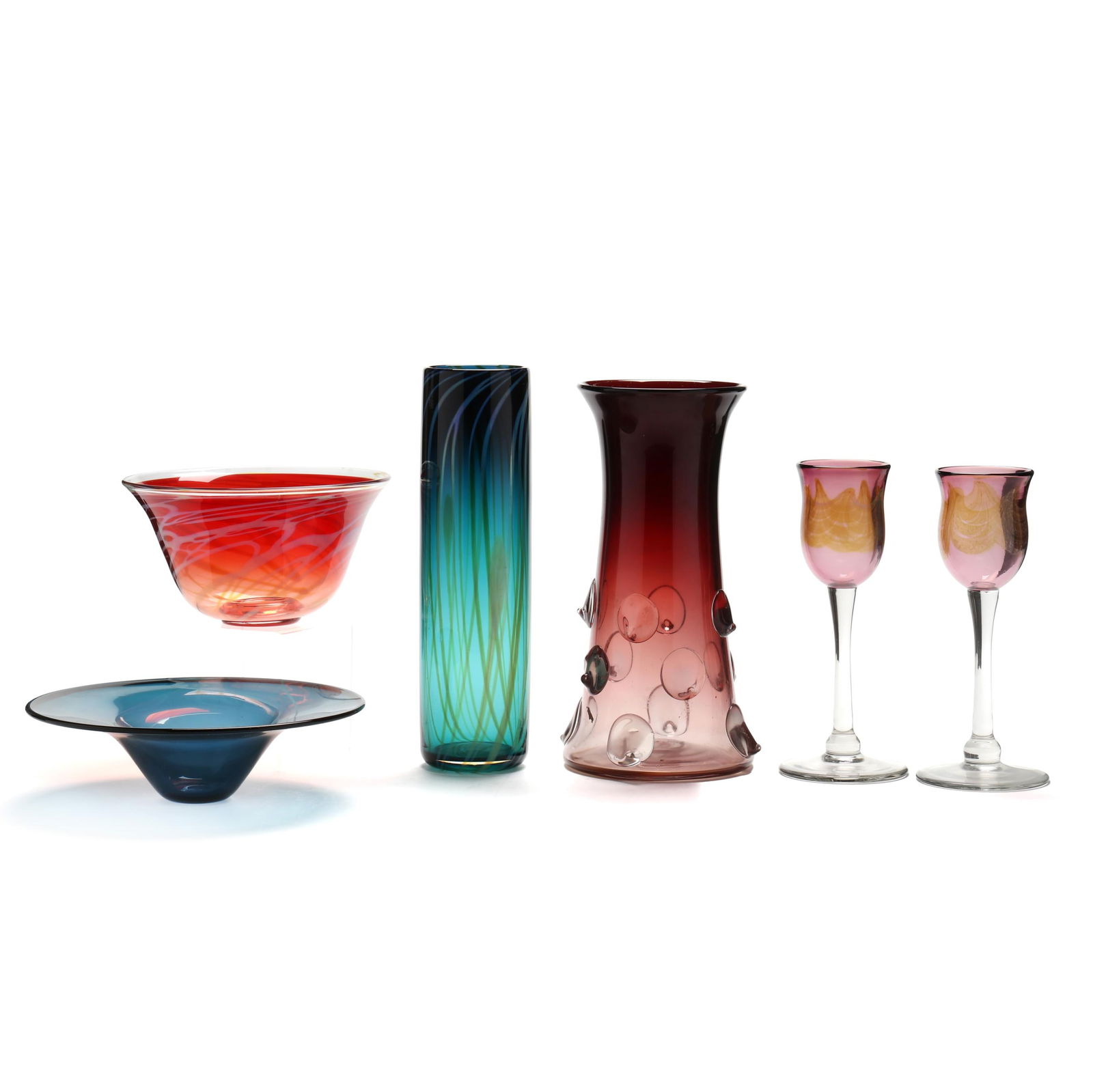 Robert Levin (NC), Six Assorted Pieces of Art Glass: Robert Levin (NC), Six Assorted Pieces of Art Glasscirca 1990, including a pair of amethyst colored goblets (9.25 in.); a dark teal striped cylinder vase (12 in.); an hombre amethyst vase with applied