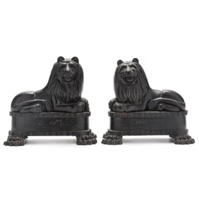 A Pair of Recumbent Lion Chenets