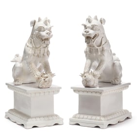 A Palatial Pair of Italian White Glazed Foo Dogs on Plinths