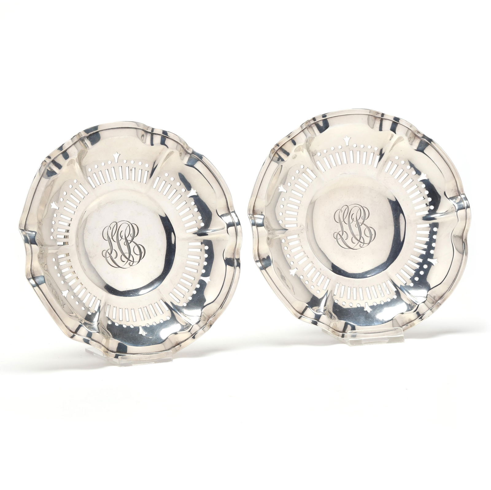 A Pair of Sterling Silver Ruffled Rim Compotes by Frank Smith: A Pair of Sterling Silver Ruffled Rim Compotes by Frank Smithretail mark of Black, Starr & Frost, pattern number 3046, reticulated flange and ruffled rim, each with a script monogram to the wells. 6 1