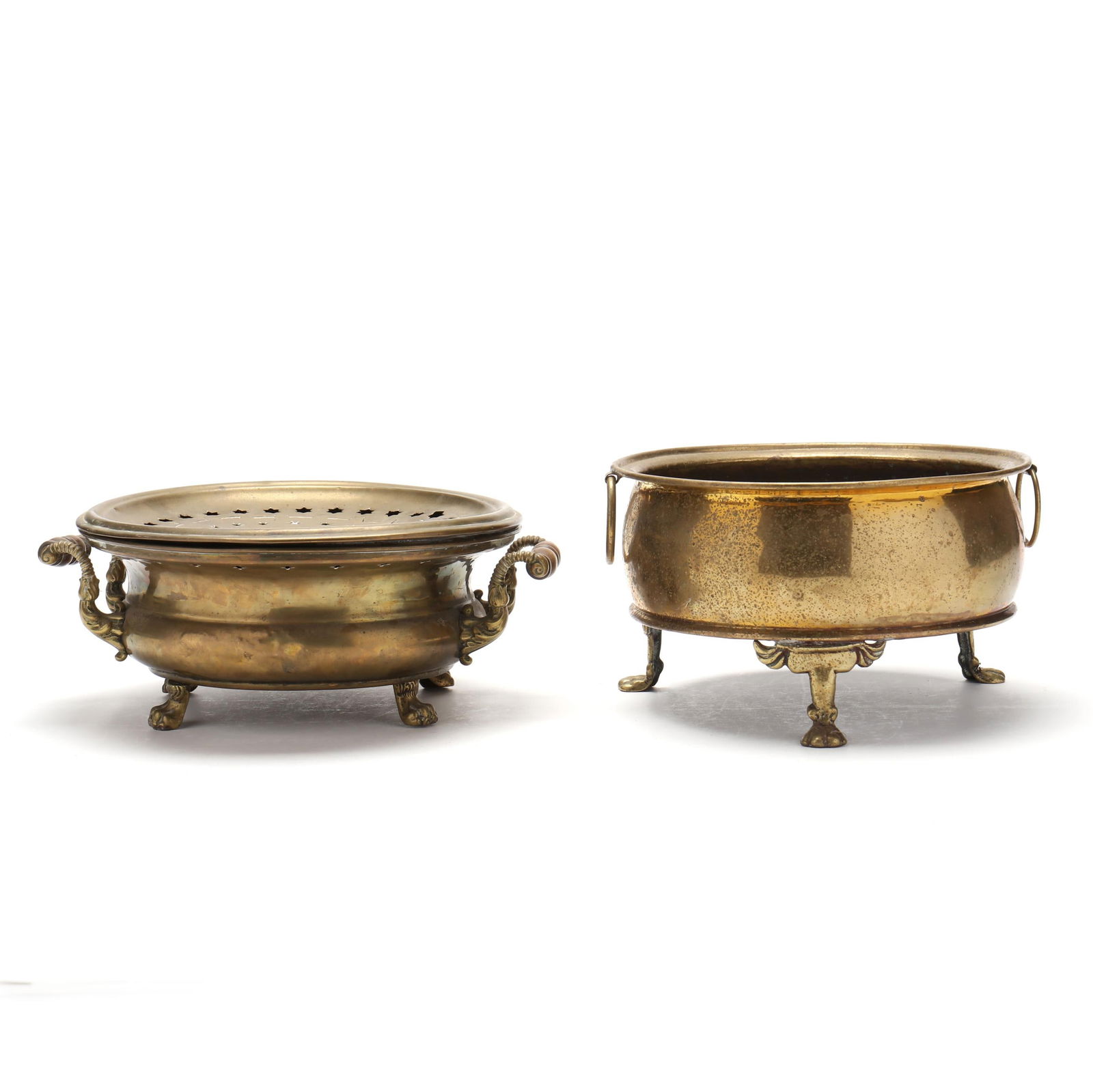 Two Antique Paw Footed Brass Warming Stands: Two Antique Paw Footed Brass Warming Stands 19th century, the first with dual turned wood handles mounted on a waisted low round urn the top with removable dovetailed pierced trivet, raised on four pa