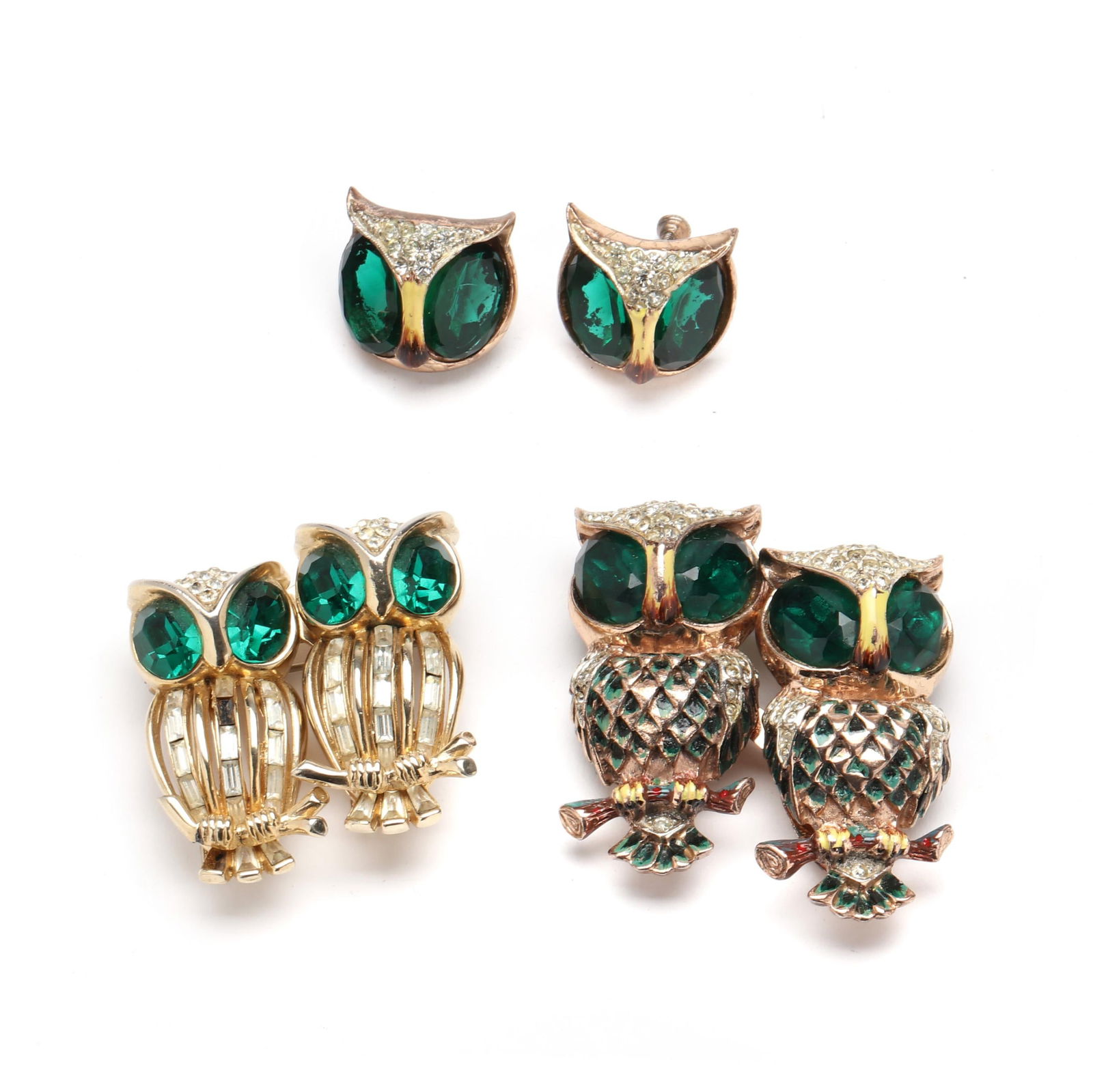 A Group of Vintage Owl Brooches and Earrings, Coro: A Group of Vintage Owl Brooches and Earrings, Coroto include: a pair of gilt owl brooches set with variously cut green and white rhinestones, completed with double pin stem, both attached to a Duette