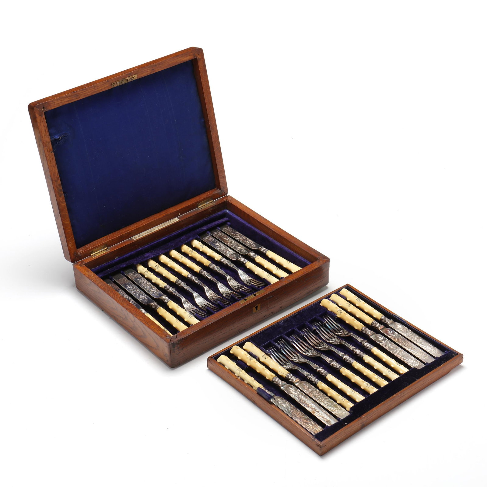 Cased Victorian Fish Service, Mark of Mappin Brothers: Cased Victorian Fish Service, Mark of Mappin Brothers mid-19th century including (12) knives (8 3/4x) and (12) forks (7 1/4 in); each featuring a bone handle and engraved decoration to the blades and 