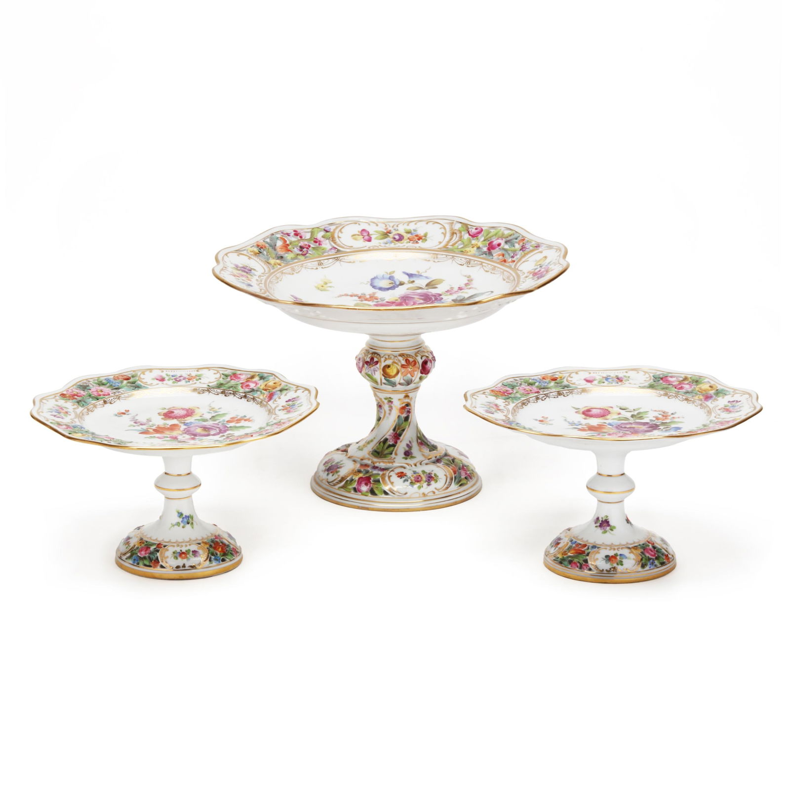 Set of Three Carl Thieme Dresden Porcelain Tazzas: Set of Three Carl Thieme Dresden Porcelain Tazzasearly 20th century, each featuring a well with a hand-painted floral spray, scalloped and reticulated flanges, over a baluster shaft and conforming ret
