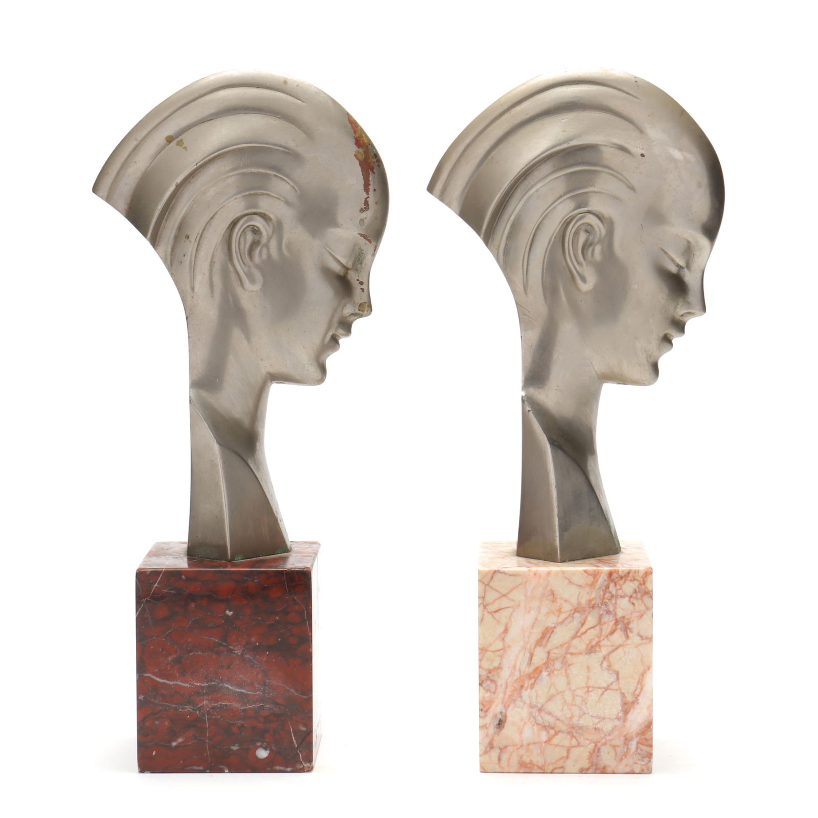 Attributed to Guido Cacciapuoti (Italian, 1892-1953), Two Art Deco Profile Bronze Busts: Attributed to Guido Cacciapuoti (Italian, 1892-1953), Two Art Deco Profile Bronze Bustscirca 1925, silver-plated bronze, unsigned, mounted upon carved marble bases. 14 3/4 x 6 1/4 x 3 1/2 in. Additio