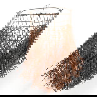 Nick Cave (American, b. 1959), Metal Basket: Nick Cave (American, b. 1959), Metal Basketwire basket with bail handle, unsigned. Included is a copy of a press release from the artist's 1997 Gallery exhibition featuring the piece. 18 x 13 x 13 in.