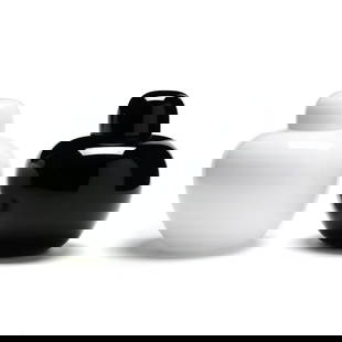 Tomaso Buzzi (Italian, 1900-1981), Black and White Glass Ginger Jars: Tomaso Buzzi (Italian, 1900-1981), Black and White Glass Ginger Jars1995 and 2002, Venini for Olivetti, each lidded form with ovoid body, signed. 9.5 in. From the Collection of Amanda Steele, Former E