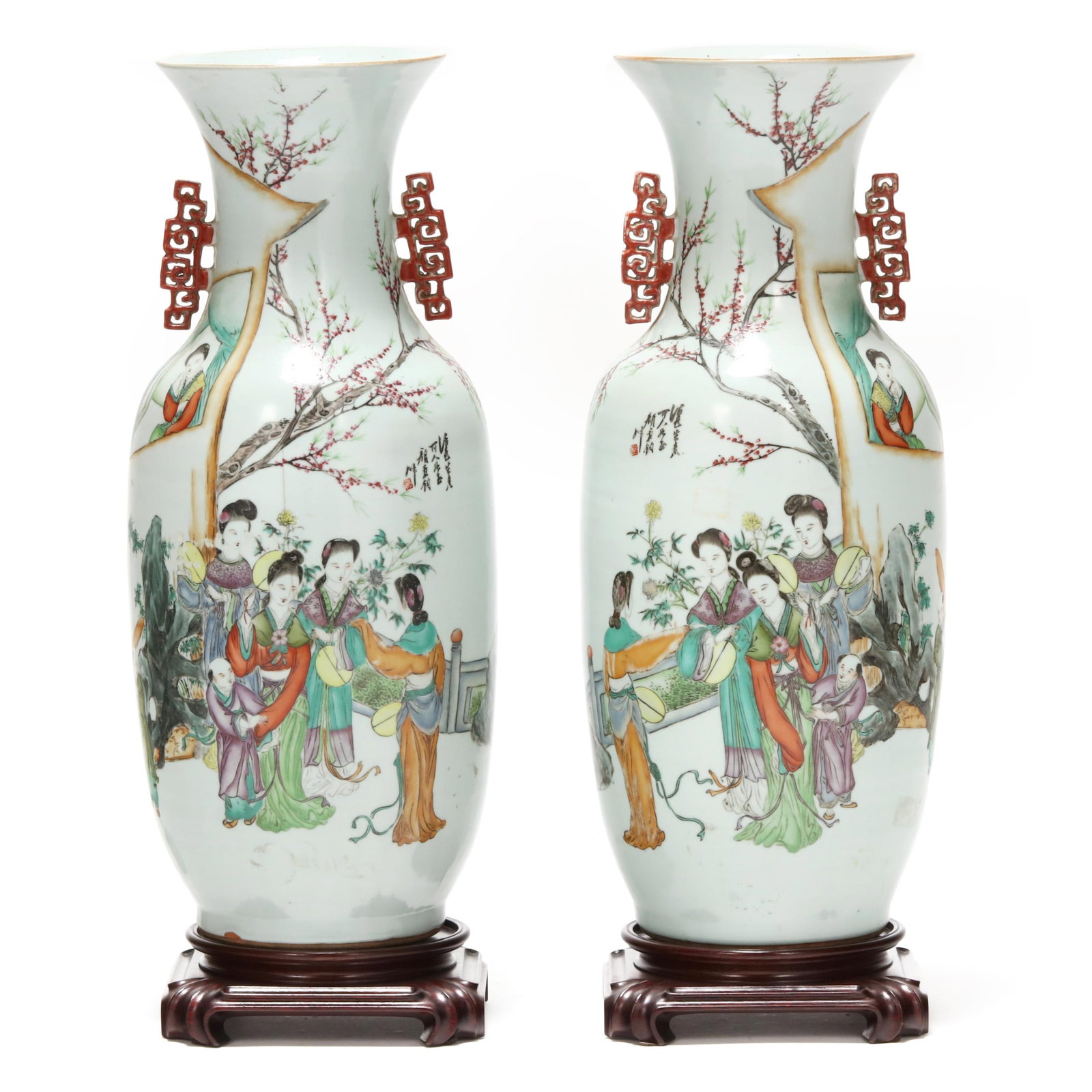 A Pair of Chinese Qianjiang Cai Vases: A Pair of Chinese Qianjiang Cai Vases Republic period (1912-1949), pair of porcelain vases, hand painted in mirror image with a group of elegant ladies gathered on an outdoor terrace under blooming pl