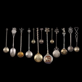 Selection of Silver Souvenir Spoons Featuring International Currency