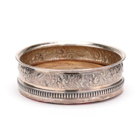 A Sterling Silver Bottle Coaster by Gorham