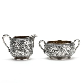 A Sterling Silver Repousse Creamer and Sugar by Dominick & Haff