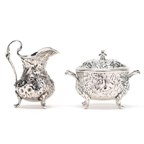 A Sterling Silver Repousse Creamer and Sugar Bowl by Jacobi & Jenkins