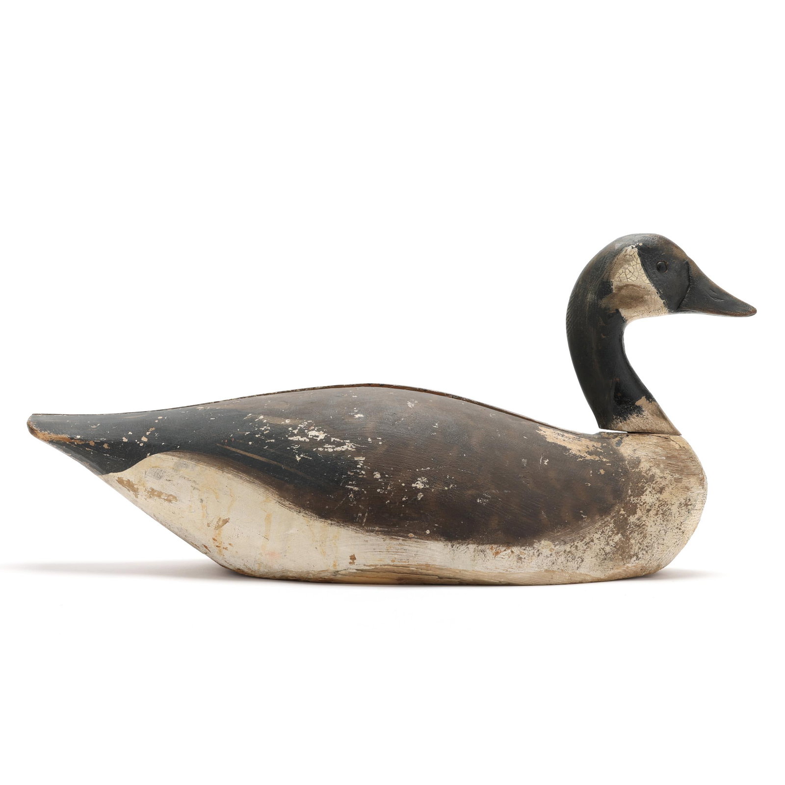 Elmer Crowell (MA,1862-1952), Goose: Elmer Crowell (MA,1862-1952), Goose East Harwich, Massachusetts, circa 1915, carved and painted wood, glass eyes, oval brand, incised W.H.N. brand. Length 23 in. Crowell was a renowned American decoy 