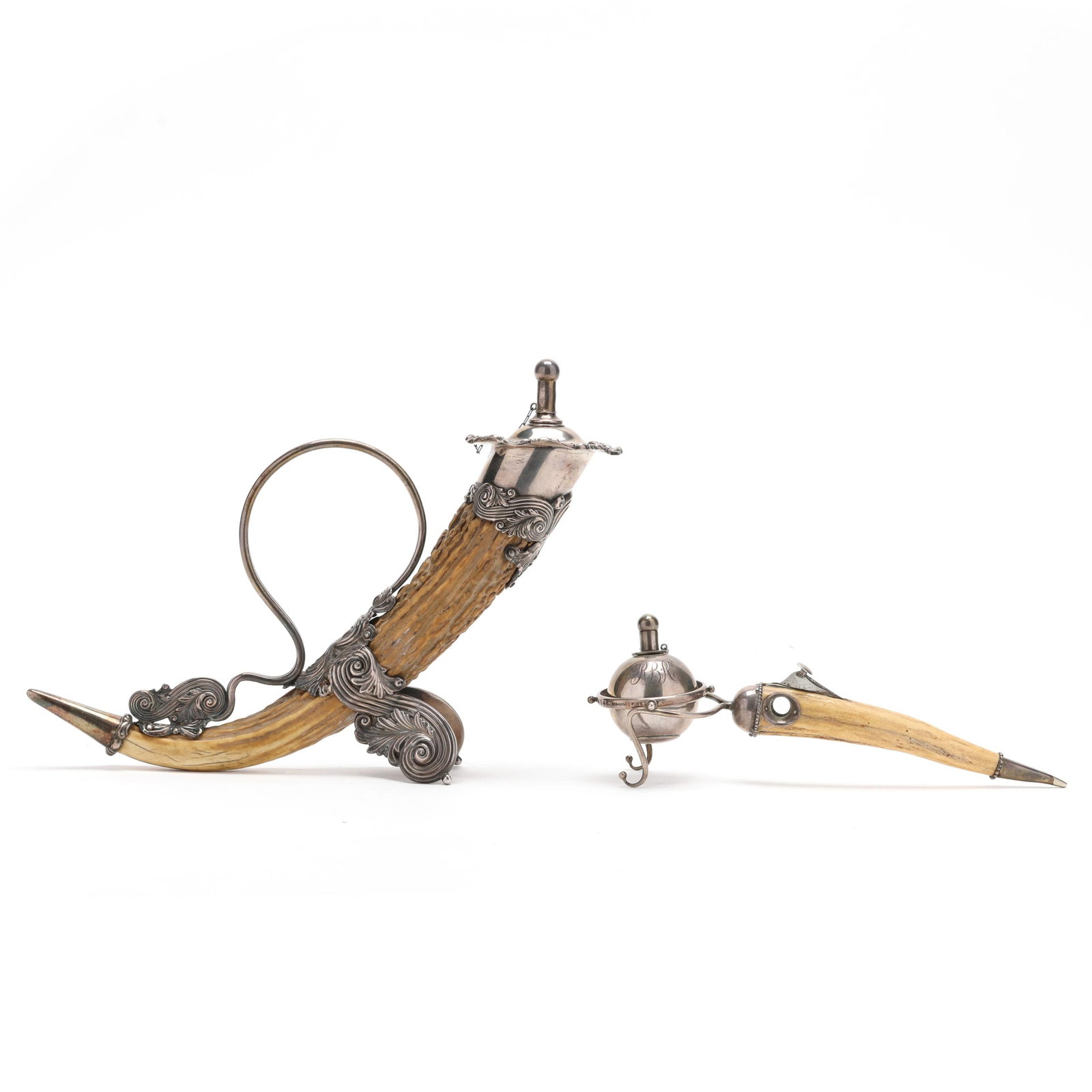 Two Gentlemen's Sterling Silver Mounted Horn Table Accessories: Two Gentlemen's Sterling Silver Mounted Horn Table AccessoriesNew York City, late 19th century, the first a gimbal table lighter with cigar cutter handle, mark of J.F. Fradley & Co., pattern number 41