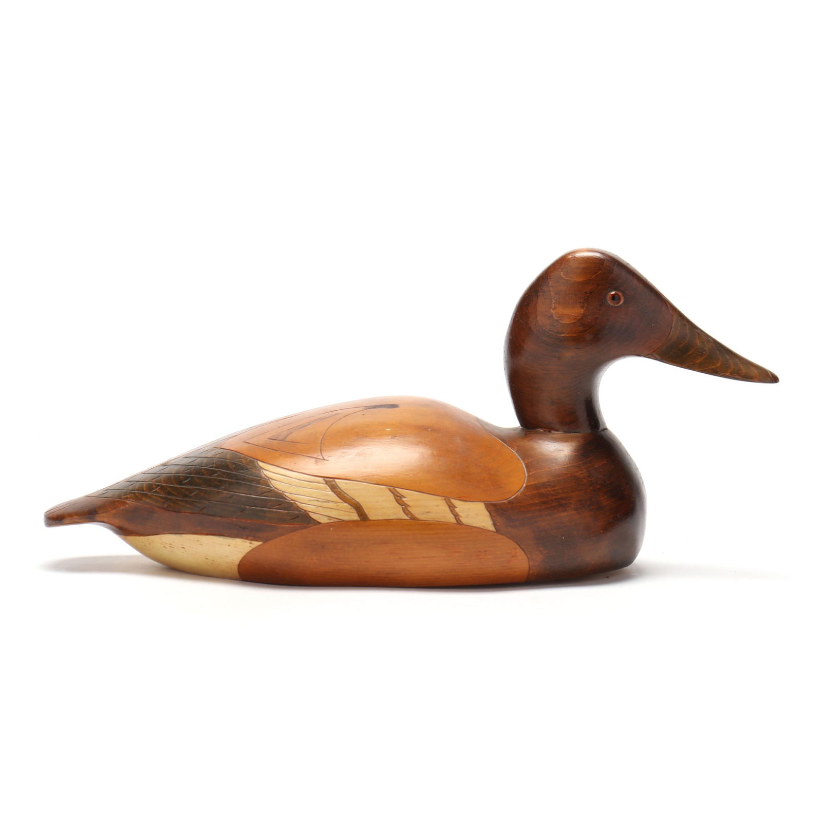 Wildfowler (NJ), Hen Canvasback in the Manner of the Ward Brothers: Wildfowler (NJ), Hen Canvasback in the Manner of the Ward BrothersPoint Pleasant, New Jersey, circa 1960s, carved and painted wood, glass eyes, Wildfowler Point Pleasant stamp. Length 16 in. A decorat