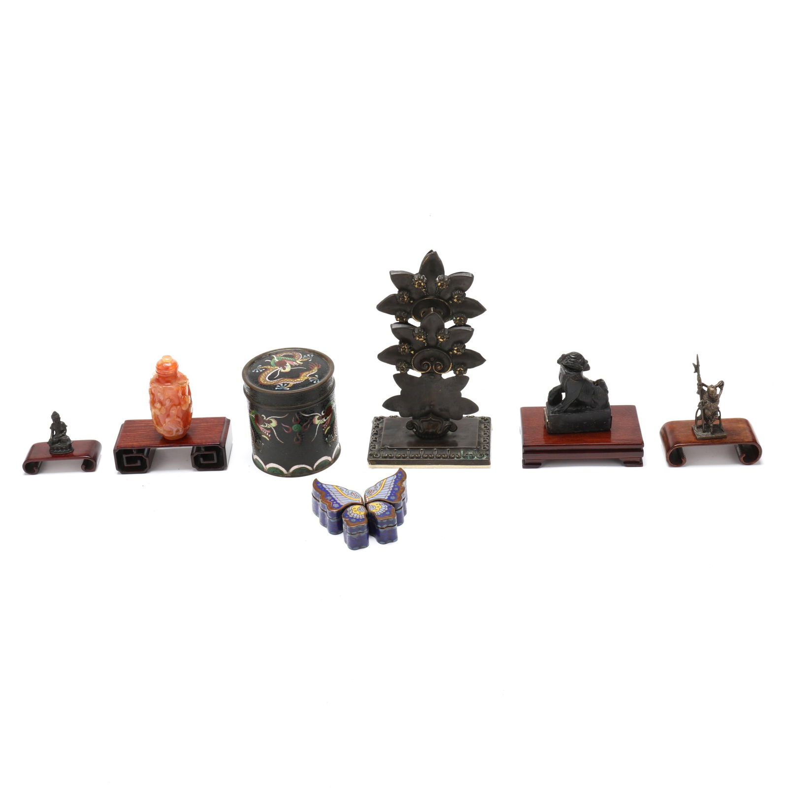 Group of Seven Asian Table Accessories: Group of Seven Asian Table Accessories20th century, includes a Chinese cloisonne tea caddy, a Chinese cloisonne butterfly puzzle box; a hardstone snuff bottle with relief carving on stand; a patinated