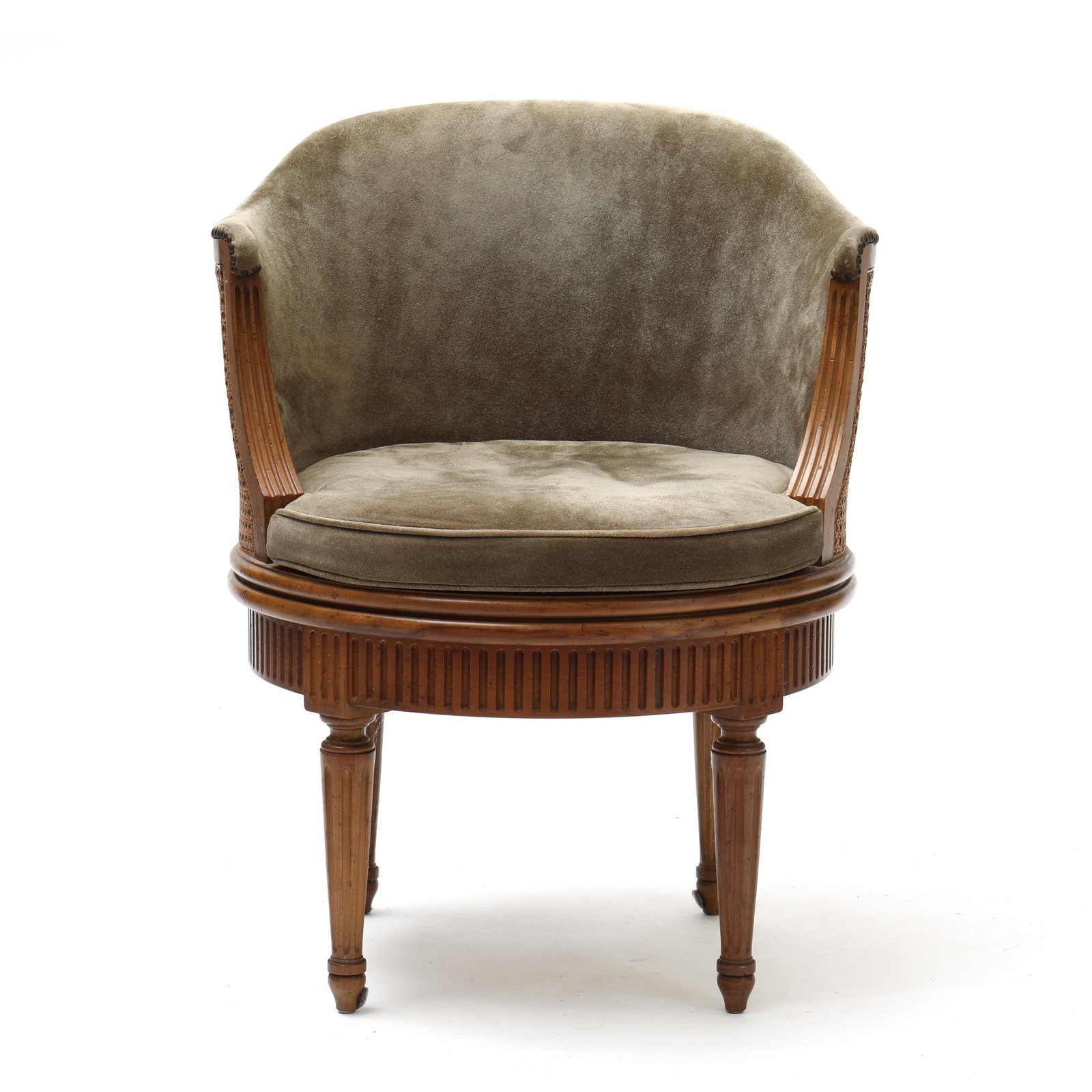 Baker, Louis XVI Style Barrel Back Revolving Chair: Baker, Louis XVI Style Barrel Back Revolving Chair late 20th century, labeled on underside, suede upholstery with brass tack trim, fluted down swept arms, slip cushion, caned seat and back, fluted ski
