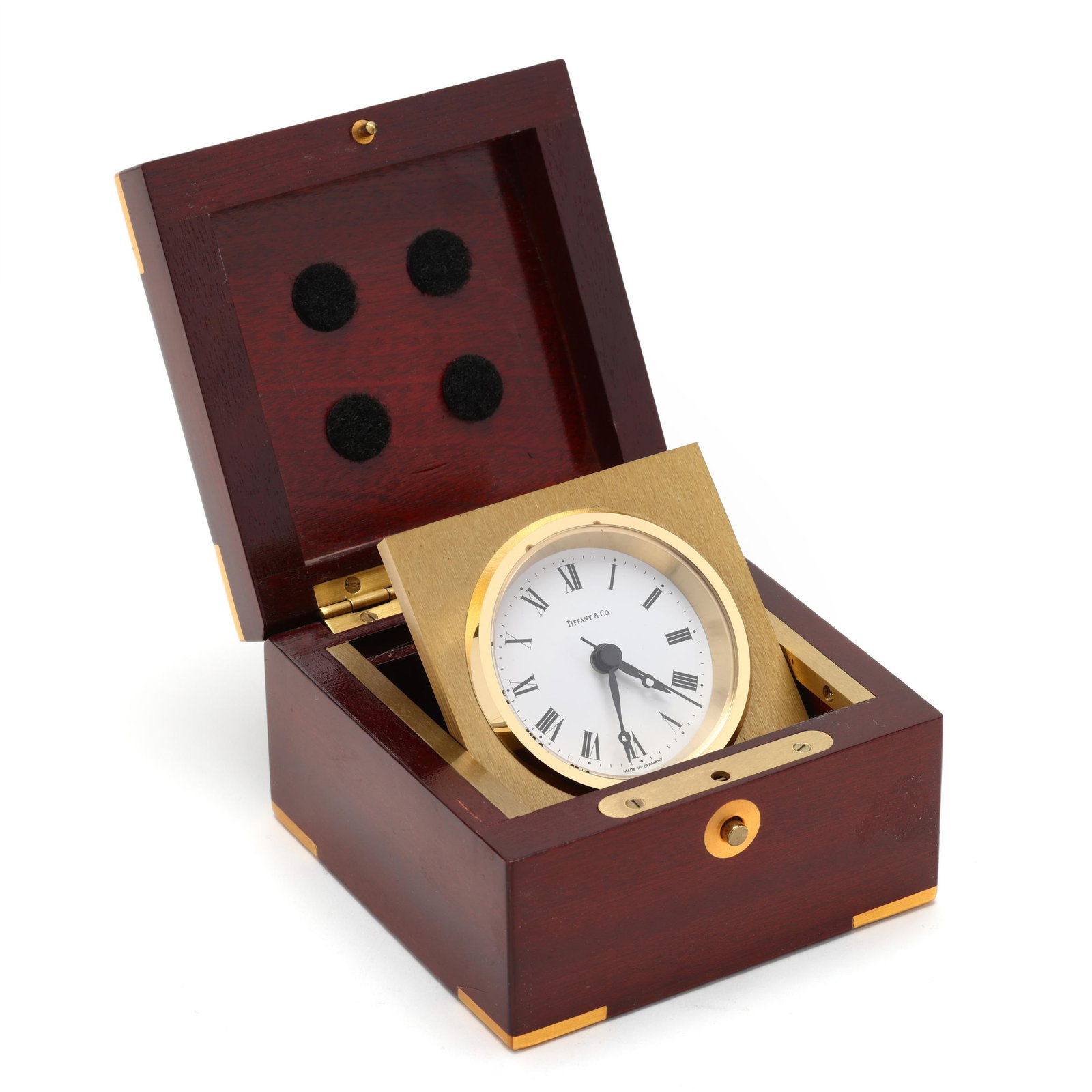 Tiffany & Co. Cased Desk Clock: Tiffany & Co. Cased Desk Clock late 20th/21st century, enamel dial marked "Tiffany & Co" within a brass surround, battery operated works marked "Germany", fitted in a mahogany case with brass mounts. 