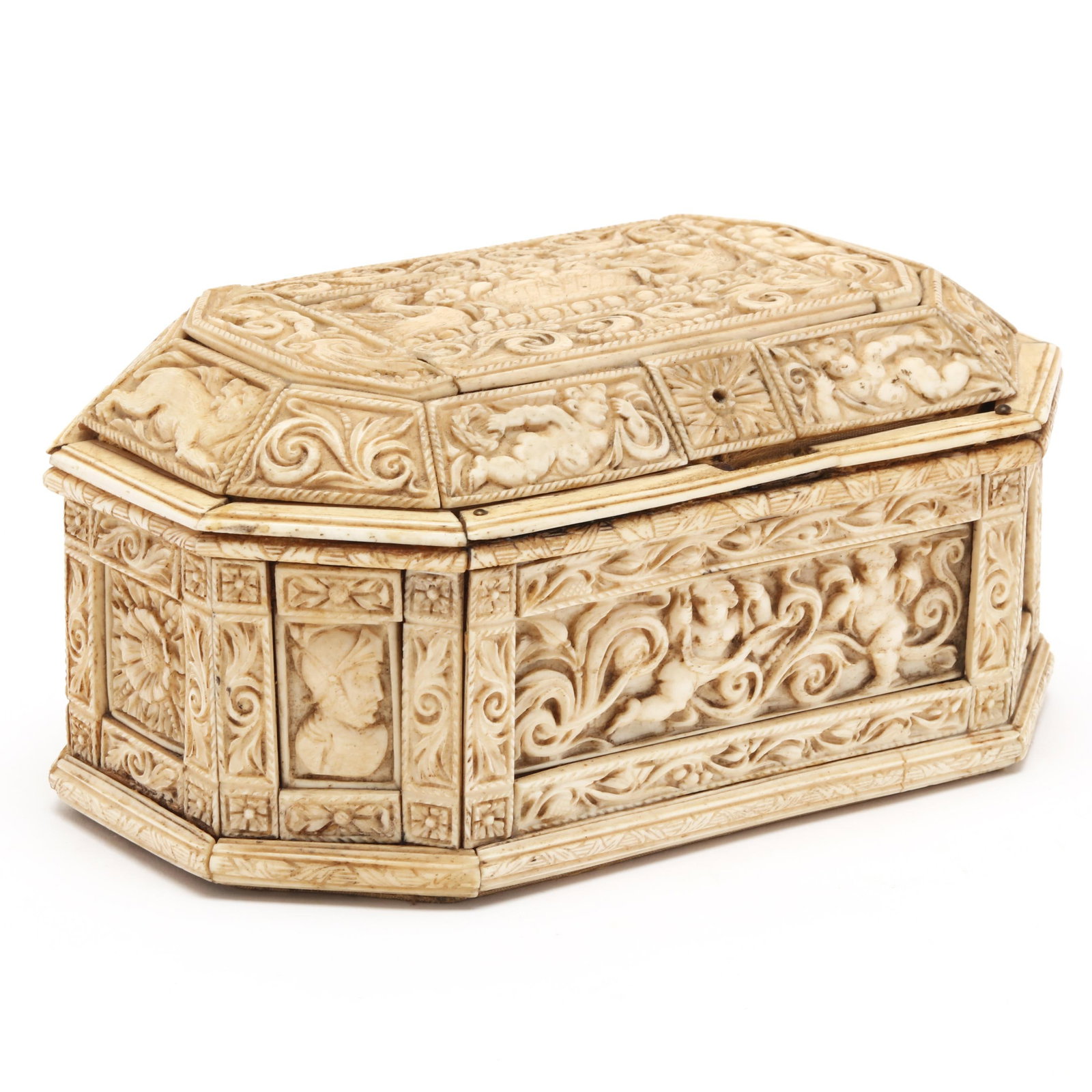 Renaissance Revival Carved Bone Dresser Box: Renaissance Revival Carved Bone Dresser Box 19th century, likely Continental, all of the surfaces are populated with putti, animals, human busts and excessive foliage; the interior is lined with gold-