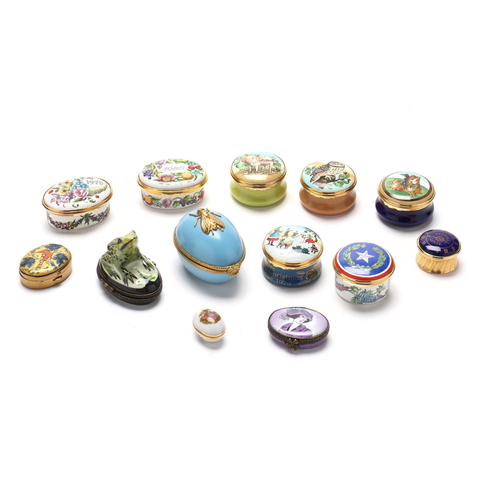A Collection of Assorted Pill Boxes, Mostly Halcyon Days and Limoges: A Collection of Assorted Pill Boxes, Mostly Halcyon Days and Limoges20th century, (13) boxes, to include: (7) Halcyon Days enamel boxes with metal mounts, including two oval forms decorated with flowe