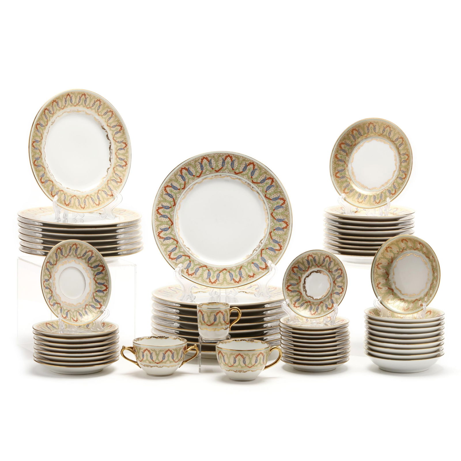 Art Nouveau Bernardaud Limoges Porcelain Part Dinner Service: Art Nouveau Bernardaud Limoges Porcelain Part Dinner ServiceFrance, (75) pieces, each with attractive gilt diapered border with red, green and blue arabesque motif, including: (9) dinner plates (9 3/4