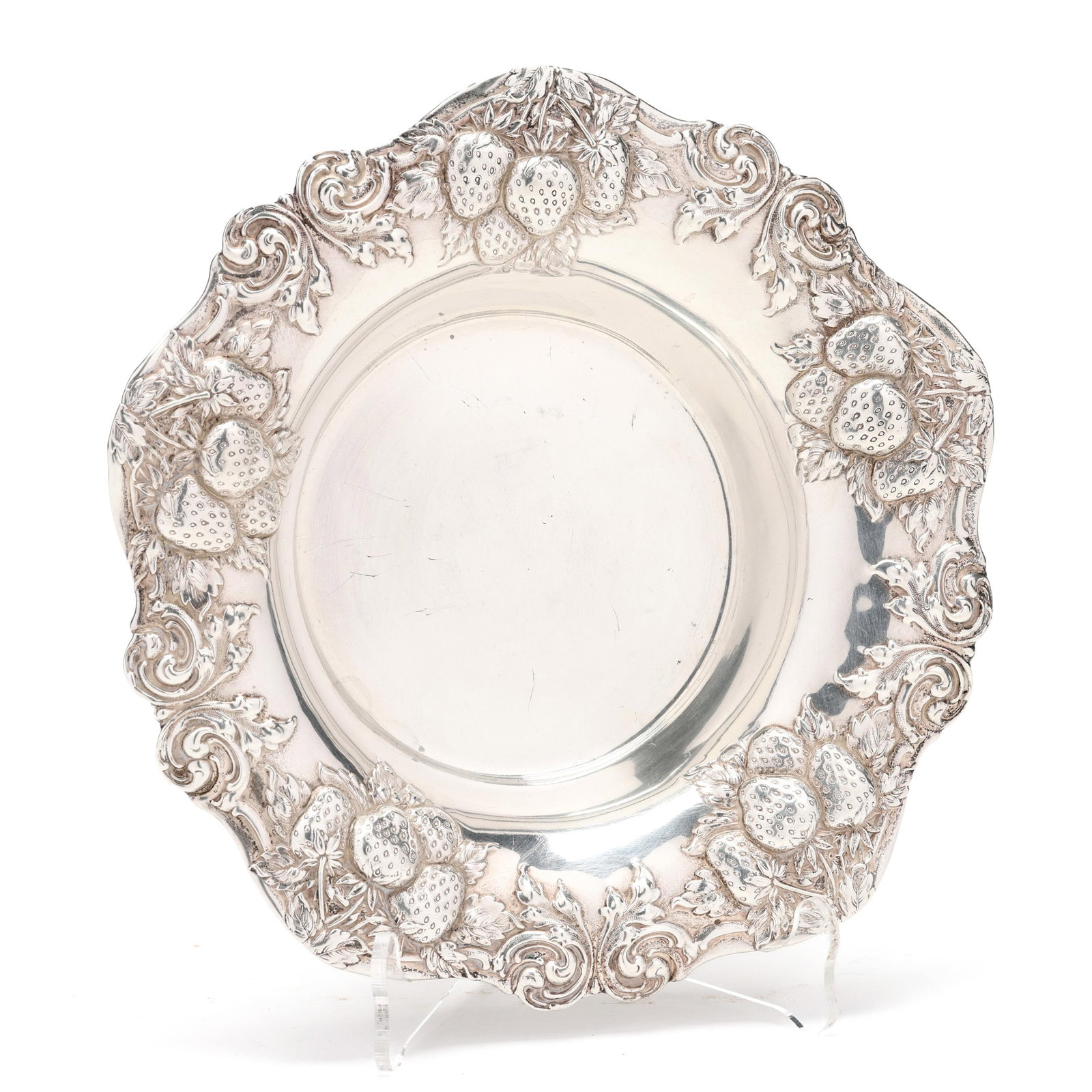 An American Sterling Silver Strawberry Bowl: An American Sterling Silver Strawberry Bowl mark of Woodside Sterling Co., pattern number 1196, with fruit and foliate motifs to the scalloped rim, without a monogram. 7 1/4 in. dia. 4.4 troy oz. Addi