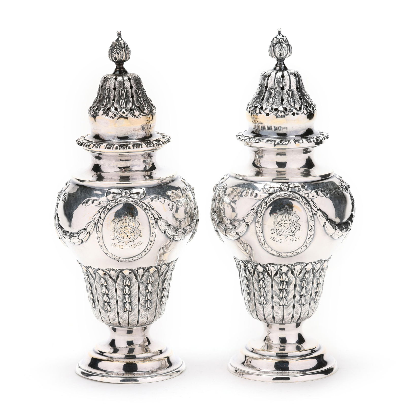 Pair of Victorian Silver Casters, Mark of Charles Stuart Harris: Pair of Victorian Silver Casters, Mark of Charles Stuart HarrisLondon (1899), each featuring acanthus decoration to the lid and body, draped garland to the shoulder, a gadrooned rim, and stepped foot,
