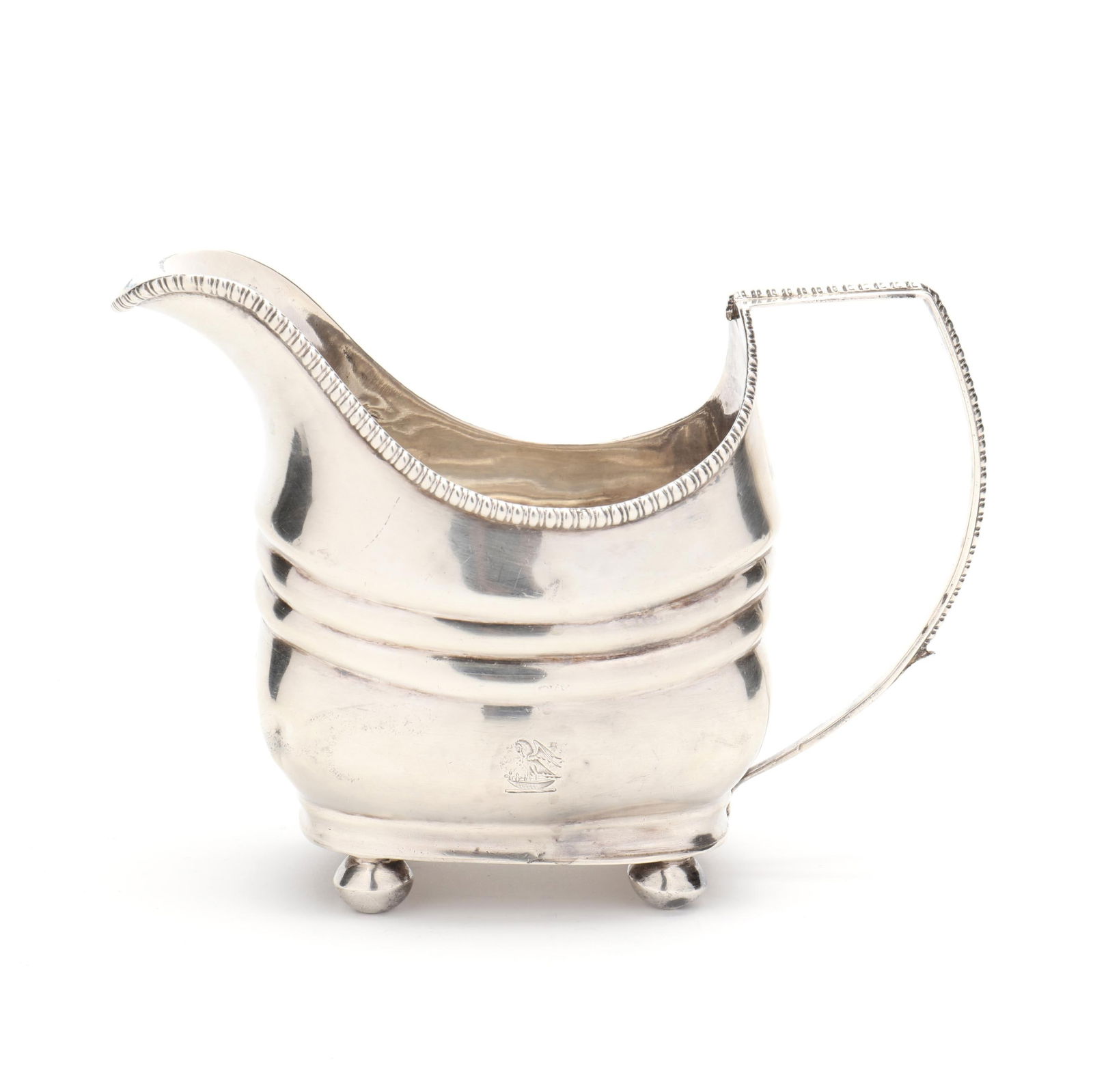 George III Irish Silver Creamer, Mark of Carden Terry & John Williams: George III Irish Silver Creamer, Mark of Carden Terry & John WilliamsDublin (1808), featuring egg and dart decoration to the rim and handle, an armorial monogram, raised on four ball feet. 4 1/2 x 6 1