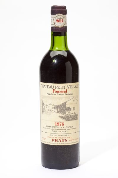 1976 Chateau Petit Village: Chateau Petit Village 1976 6 bottles Pomerol 2vts, 2ts, 2hs Removed from a large subterranean wine cellar of an avid Buffalo, New York wine collector and wine educator.