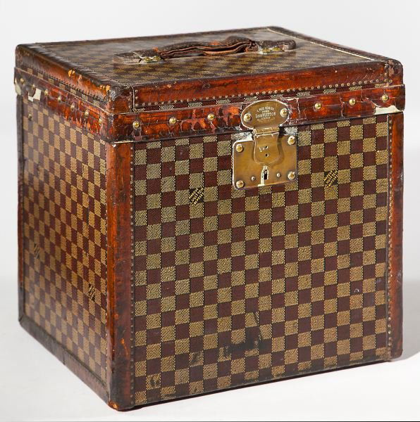 Rare Gentleman's Top Hat Hatbox, Louis Vuitton: Rare Gentleman's Top Hat Hatbox, Louis VuittonFrench, circa 1900, composed of Damier canvas bound and trimmed in brass tack glazed calf-skin, completed by its original stamped handle, and the original