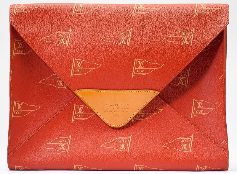 America's Cup Document Portfolio, Louis Vuitton: America's Cup Document Portfolio, Louis Vuitton French, 1994 limited edition, designed in envelope form of red canvas with overall flag logo, the front with natural leather trim embossed "Louis Vuitto