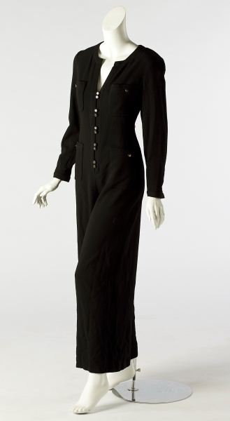 A Stylish Wool Jumpsuit, by Chanel: A Stylish Wool Jumpsuit, by Chanel French, late 20th century, designed as a very chic black one piece wool jumpsuit with four pocket detailing, the front with zipper and five station closures containi
