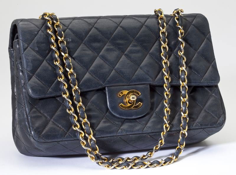 A Classic Navy Leather 2.55 Flap Bag, Chanel: A Classic Navy Leather 2.55 Flap Bag, ChanelFrench, circa 1980s, designed in the classic 2.55 rectangular shape, composed of quilted navy leather and gold hardware, with shoulder strap which may be wo