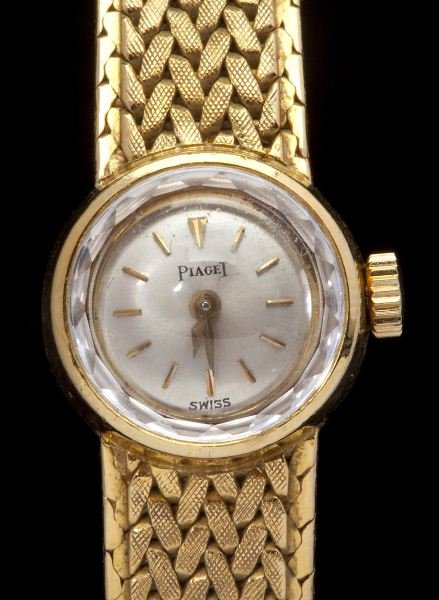 Fine Lady's Gold Wristwatch, Piaget: Fine Lady's Gold Wristwatch, Piaget circa 1960, centering on a round case, the face set with baton numeral indicators, completed by original woven gold strap and fold over clasp with attached safety c