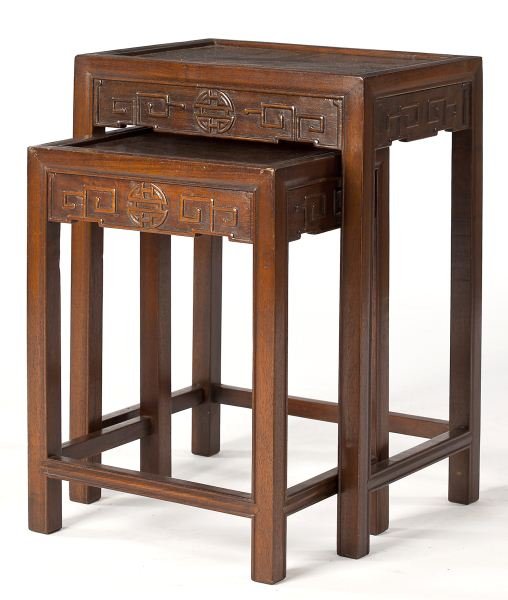 Two Graduated Chinese Hardwood Stands: Two Graduated Chinese Hardwood Stands nesting form, early 20th century, each with a recessed paneled top, relief carved frieze, molded legs, stretcher base. DOA 23.5 x 16.75 x 12.5 in.; the smaller st