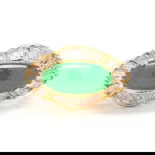 Gold, Jadeite Jade, and Diamond Ring: Gold, Jadeite Jade, and Diamond Ringring set with an oval cabochon green jadeite jade (12.12 x 5.53 mm) within a shaped halo of channel set tapered baguette cut diamonds weighing approximately .75 tot