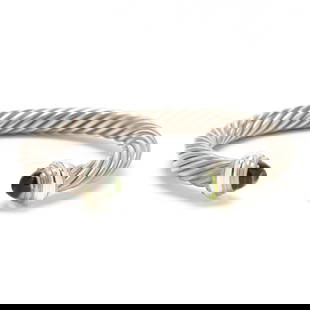 Sterling Silver, Gold, and Peridot Cable Cuff Bracelet, David Yurman: Sterling Silver, Gold, and Peridot Cable Cuff Bracelet, David Yurmanthe silver cable cuff bracelet set with cabochon peridots with yellow gold accents to the terminals, signed and stamped 925 585. 7mm