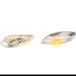 Two Sterling Silver and Gold Rings, David Yurman: Two Sterling Silver and Gold Rings, David Yurmanto include: a ring centered on an oval checkerboard cut citrine (8.0 x 6.0 mm), bezel set in yellow gold with DY logo, the silver shank in cable motif,