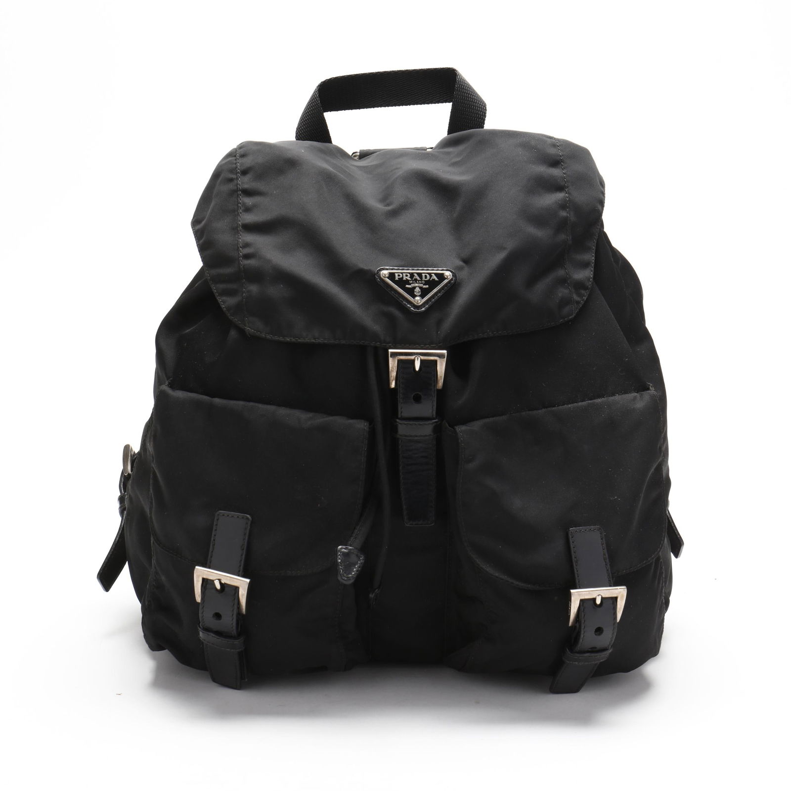 Black Nylon Backpack, Prada: Black Nylon Backpack, Pradathe exterior in black Tessuto nylon with silver-tone hardware, nylon shoulder straps and handle, two smaller pockets with snap and buckle closures, and main pocket with draw