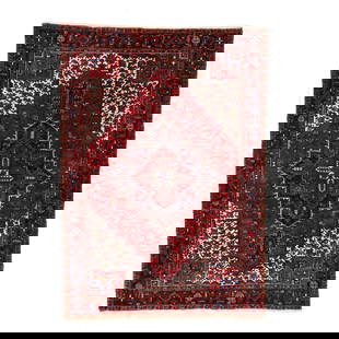 Heriz Carpet: Heriz Carpet wool on cotton foundation, the deep red field with central star medallion emanating with foliate motifs, the cream spandrels with foliate motifs, the main black border with geometric