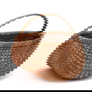 Large Antique Southern Buttocks Basket: Large Antique Southern Buttocks Basketfirst quarter 20th century, woven splint oak with bentwood frame, with nice darkened patina and nailed at the handle and rim juncture, unsigned. 16 x 16 x 15 in.