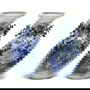 A Pair of Chinese Porcelain Blue and White Vases with Bird Motifs: A Pair of Chinese Porcelain Blue and White Vases with Bird Motifs19th century, two light celadon green ground porcelain vases hand painted with large blue and white flowers and birds decorating the fr
