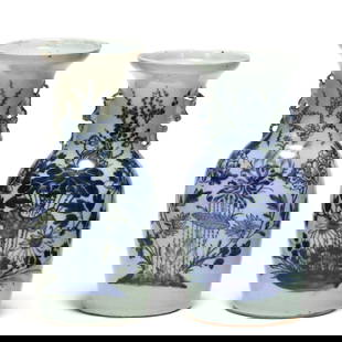 A Pair of Chinese Porcelain Blue and White Vases with Bird Motifs: A Pair of Chinese Porcelain Blue and White Vases with Bird Motifs19th century, two light celadon green ground porcelain vases with double foo lion handles flanking the neck and large blue and white fl