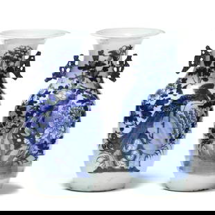 A Pair of Chinese Porcelain Blue and White Vases with Bird Motifs: A Pair of Chinese Porcelain Blue and White Vases with Bird Motifs19th century, two light celadon green ground porcelain vases hand painted with large blue and white flowers and birds decorating the fr