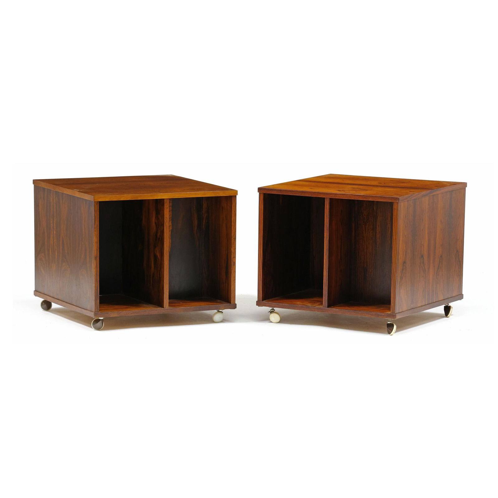 Pair of Danish Rosewood Record Cabinets: Pair of Danish Rosewood Record Cabinetscirca 1960, possibly by Bodil Kjaer, high grade rosewood book-matched veneers, open divided compartments, on casters, unmarked. 17.5 x 20.5 x 20.5 in. Additiona