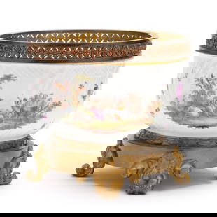 German Porcelain and Ormolu Cachepot: German Porcelain and Ormolu Cachepotearly 19th century, a gilt and hand-painted porcelain cachepot with rural vignettes and floral decoration, likely by Hochst, later mounted to ormolu pedestal with f