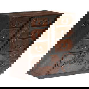 An Antique Japanese Sakata Ko Dansu Personal Storage Chest: An Antique Japanese Sakata Ko Dansu Personal Storage ChestMeiji period (1868-1912), late 19th century, keyaki (cedar) wood with iron mounts, dovetailed case with bail handles, the case with four drawe