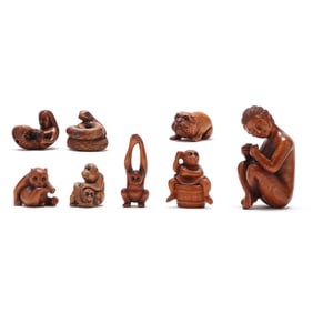 A Group of Eight Japanese Carved Wood Netsukes