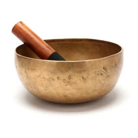 A Southeast Asian Hammered Brass Singing Bowl
