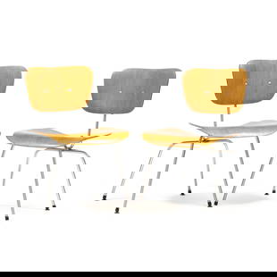 Charles and Ray Eames, Pair of  DCM Chairs: Charles and Ray Eames, Pair of DCM Chairslate 20th century production, ash veneer, polished steel frame with black plastic capped feet, one chair with underside of seat stamped DCM, the other chair is